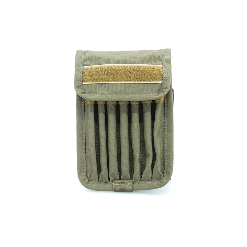 A ranger green shooting notebook cover made from Cordura material, featuring Velcro fastening and pen slots.